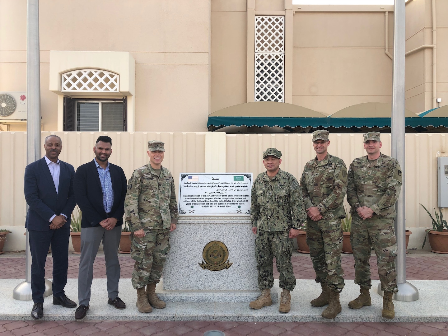 Peter Skillings, DLA Troop Support Medical’s Collective and Foreign Military Sales branch chief, left, and Abin Mathai, DLA Troop Support Medical’s Dressing, Tools and Instruments integrated support team chief, second to left, pose for a photo in Riyadh, Saudi Arabia May 2019.
