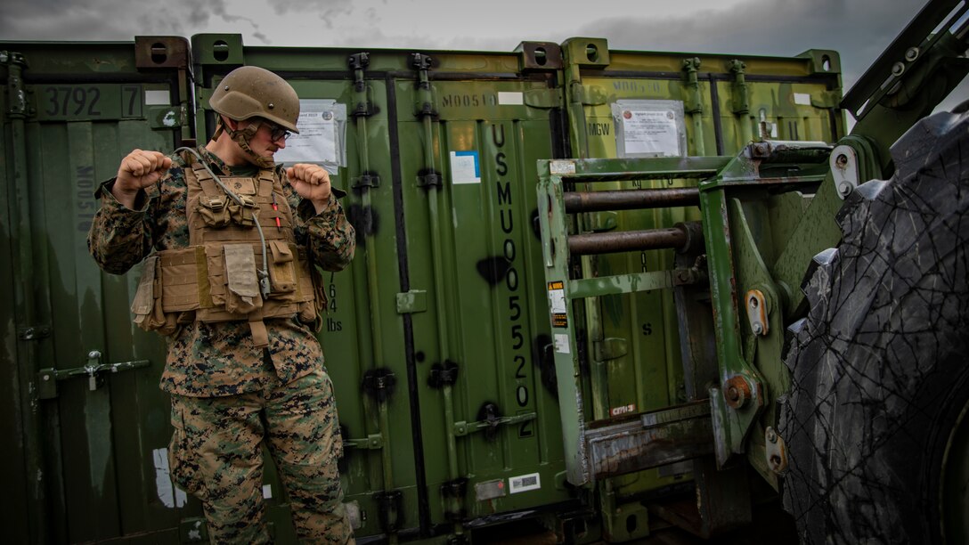 U.S. Marine Corps Lance Cpl. Jacob Dunkin, a motor vehicle operator with Marine Wing Support Squadron 471, Marine Aircraft Group 41, 4th Marine Aircraft Wing, directs a tractor at Canadian Forces Base Cold Lake, Canada, June 19, 2019, in support of Sentinel Edge 19. Training exercises, such as SE19, ensure Reserve Marines are proficient and capable of successful integration with active-duty Marines, making MARFORRES critical to the Marine Corps’ Total Force. (U.S. Marine Corps photo by Lance Cpl. Jose Gonzalez)