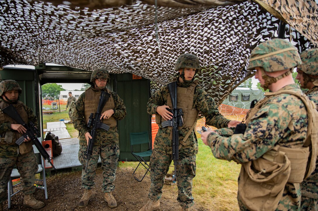 U.S. Marines with Marine Wing Support Squadron 471, Marine Aircraft Group 41, 4th Marine Aircraft Wing, guard an entrance at Canadian Forces Base Cold Lake, Canada, June 19, 2019, in support of Sentinel Edge 19. Training exercises, such as SE19, ensure Reserve Marines are proficient and capable of successful integration with active-duty Marines, making MARFORRES critical to the Marine Corps’ Total Force. (U.S. Marine Corps photo by Lance Cpl. Jose Gonzalez)