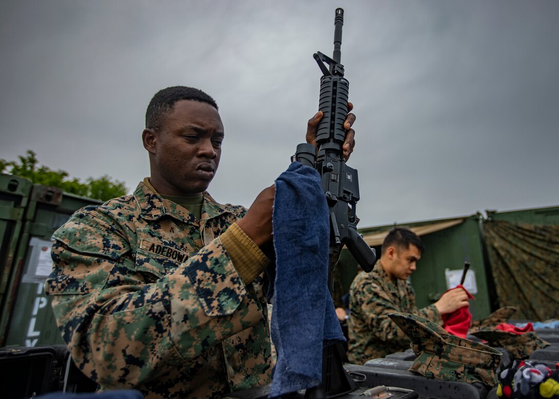 U.S. Marine Corps Lance Cpl. Olusegun Adebowale, an administrative specialist with Marine Wing Support Squadron 471, Marine Aircraft Group 41, 4th Marine Aircraft Wing, cleans an M16A4 service rifle at Canadian Forces Base Cold Lake, Canada, June 19, 2019, in support of Sentinel Edge 19. Training exercises, such as SE19, ensure Reserve Marines are proficient and capable of successful integration with active-duty Marines, making MARFORRES critical to the Marine Corps’ Total Force. (U.S. Marine Corps photo by Lance Cpl. Jose Gonzalez)