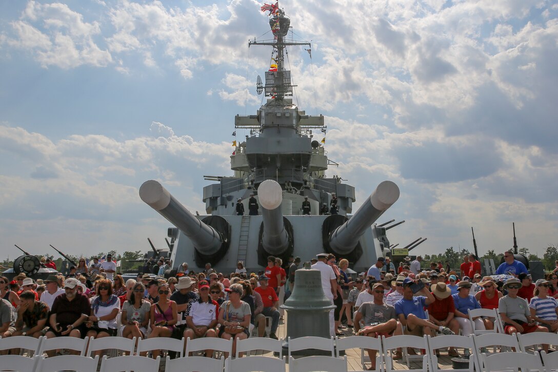 Crowd members find their seats before the 58th annual Memorial Day Observance ceremony aboard the USS North Carolina in Wilmington, North Carolina, May 27, 2019. Hundreds of veterans, friends, family members and community leaders honored those who lost their lives in military service of the United States during the 58th annual Memorial Day Observance ceremony. Marines from Marine Corps Base Camp Lejeune served as color guard and ceremonial detail.