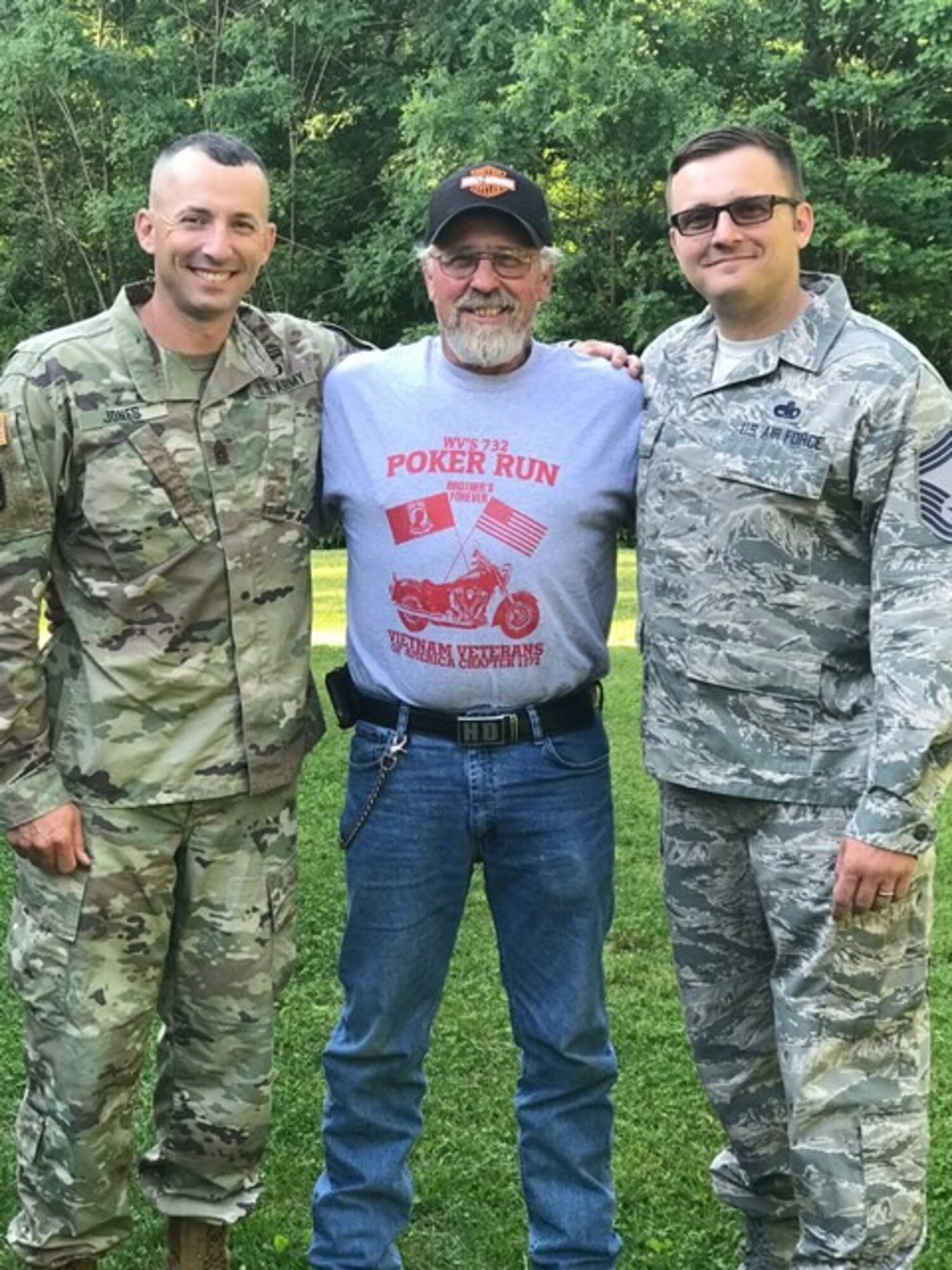 Command Sgt. Maj. Dusty Jones and Chief Master Sgt. Eric Jones pose for a photo with their father, Steve Jones. Steve is an influential part of their lives and is crediting with their successful rise in the ranks of the West Virginia National Guard. (Courtesy photo)