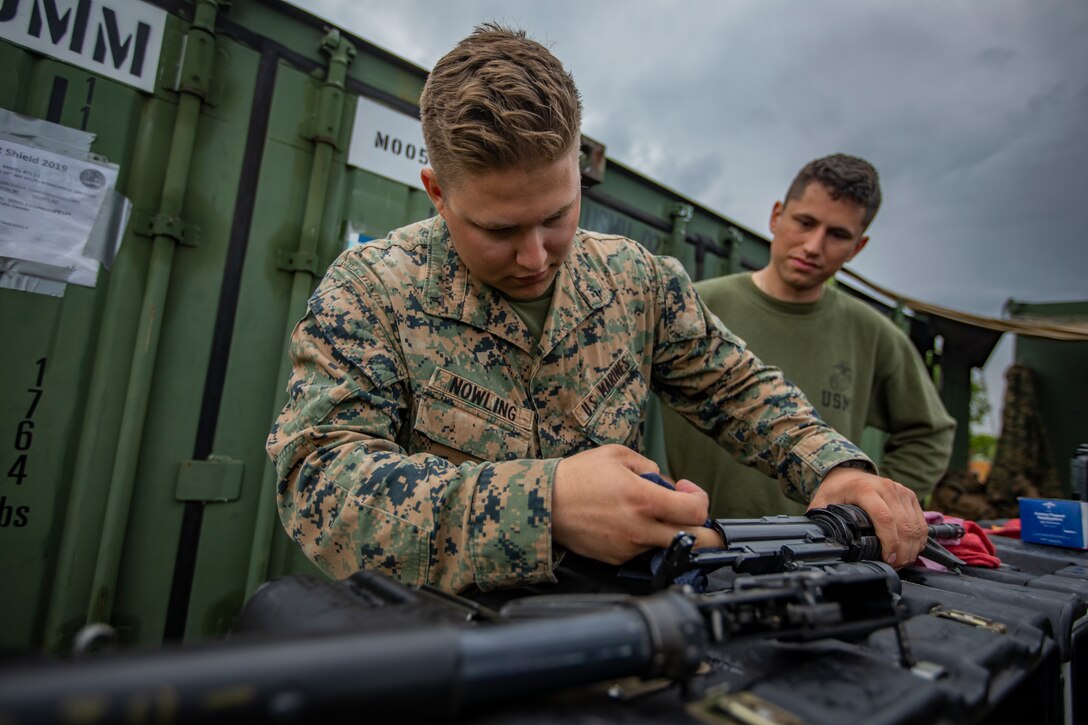 U.S. Marine Corps Lance Cpl. Jason Nowling, a motor vehicle operator with Marine Wing Support Squadron 471, Marine Aircraft Group 41, 4th Marine Aircraft Wing, cleans an M16A4 service rifle at Canadian Forces Base Cold Lake, Canada, June 19, 2019, in support of Sentinel Edge 19. Training exercises, such as SE19, ensure Reserve Marines are proficient and capable of successful integration with active-duty Marines, making MARFORRES critical to the Marine Corps’ Total Force. (U.S. Marine Corps photo by Lance Cpl. Jose Gonzalez)