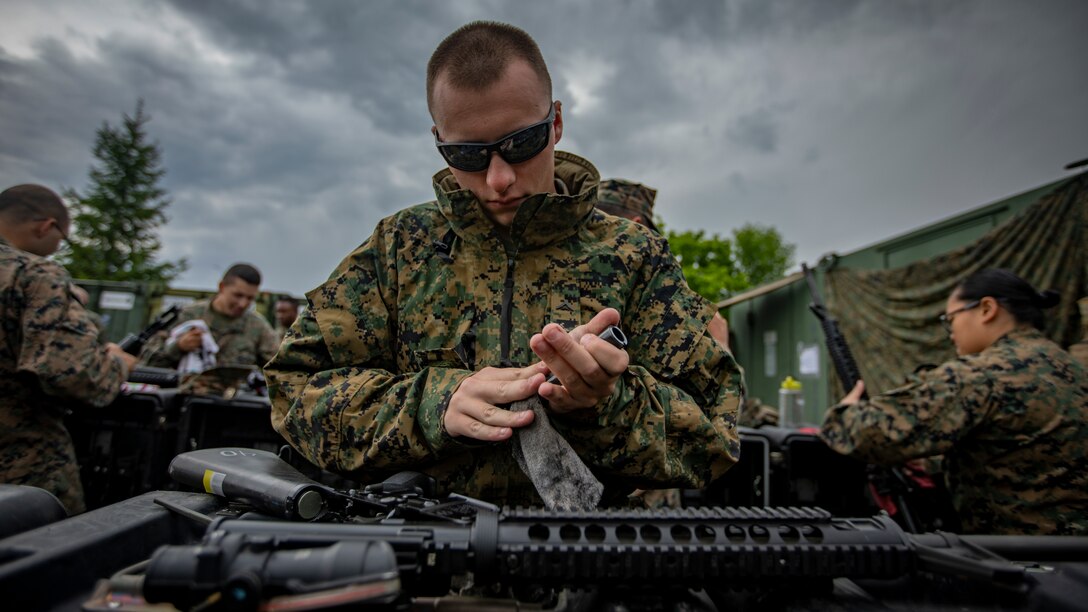 U.S. Marine Corps Lance Cpl. Brandon Wise, a motor vehicle operator with Marine Wing Support Squadron 471, Marine Aircraft Group 41, 4th Marine Aircraft Wing, cleans an M16A4 service rifle at Canadian Forces Base Cold Lake, Canada, June 19, 2019, in support of Sentinel Edge 19. Training exercises, such as SE19, ensure Reserve Marines are proficient and capable of successful integration with active-duty Marines, making MARFORRES critical to the Marine Corps’ Total Force. (U.S. Marine Corps photo by Lance Cpl. Jose Gonzalez)