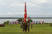 U.S. Marine Corps Col. Brian Mullery with Combat Logistics Regiment 27, 2nd Marine Logistics Group (left), receives the unit colors from Col. Boyd Miller with CLR-27, 2nd MLG (Right), during a change of command ceremony at Camp Lejeune, North Carolina, June 19, 2018. During the change of command Col. Boyd Miller relinquished command of CLR-27 to Col. Brian W. Mullery. 

(U.S. Marine Corps photo by Cpl. Damion Hatch Jr.)