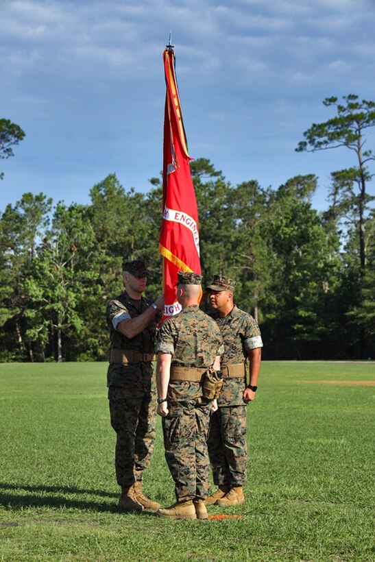 U.S. Marine Corps Lt. Col. Robert P. Gerbracht, left, commanding officer of 8th Engineer Support Battalion, 2nd Marine Logistics Group, receives the unit colors from Lt. Col. Patrick G. Manson during a change of command ceremony at Camp Lejeune, North Carolina, June 19, 2019. During the ceremony, Manson relinquished command of 8th ESB to Gerbracht. 

(U.S. Marine Corps photo by Gunnery Sgt. Jason W. Fudge)