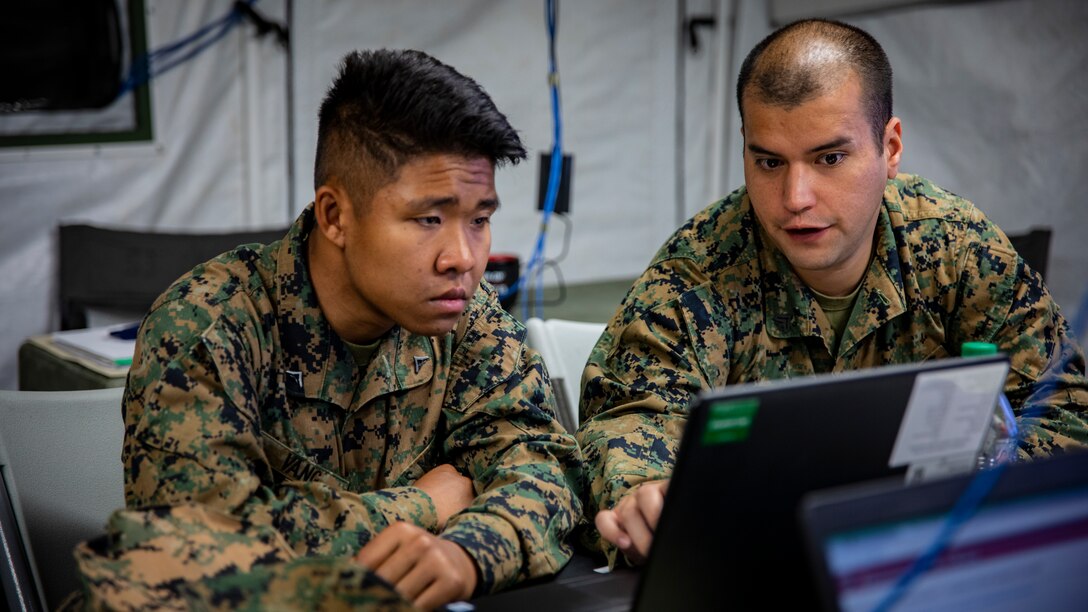 U.S. Marine Corps Lance Cpl. WaFue Vang, left, and Cpl. Eddy Valdes, right, both administrative specialists with Marine Wing Support Squadron 471, Marine Aircraft Group 41, 4th Marine Aircraft Wing, finalize preparations for a convoy at Canadian Forces Base Cold Lake, Canada, June 19, 2019, in support of Sentinel Edge 19. Training exercises, such as SE19, ensure Reserve Marines are proficient and capable of successful integration with active-duty Marines, making MARFORRES critical to the Marine Corps’ Total Force. (U.S. Marine Corps photo by Lance Cpl. Jose Gonzalez)