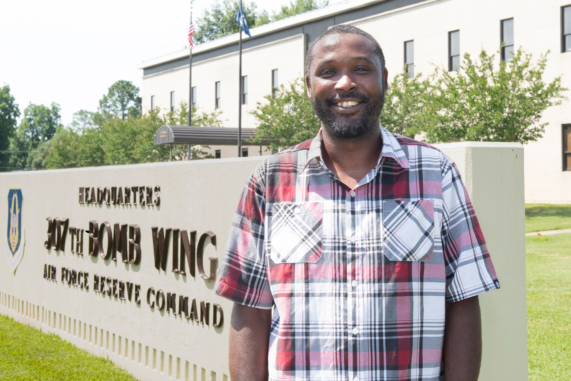 Phillip Floyd, 307th Bomb Wing budget technician, stands in front of the 307th's headquarters building at Barksdale Air Force Base, Louisiana, June 19, 2019. Floyd recently became the first recipient of the Elsie Steffany Memorial Scholarship, which will help to offset the costs of his efforts to earn the Department of Defense Financial Manager Certification. (U.S. Air Force photo by Master Sgt. Ted Daigle)