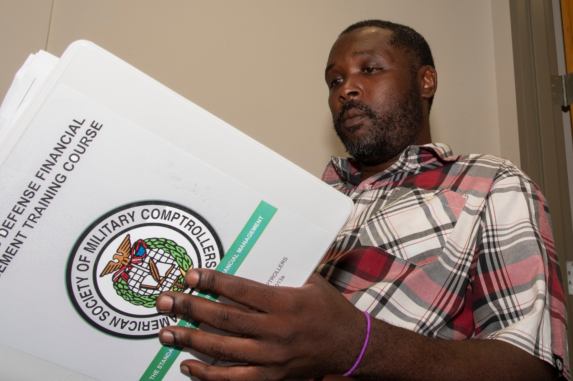 Phillip Floyd, 307th Bomb Wing budget technician, reviews study materials for the Department of Defense Financial Manager Certification course at Barksdale Air Force Base, Louisiana, May 19, 2019.  He recently became the first recipient of the Elsie Steffany Memorial Scholarship, an award that helps defray the costs associated with the course.  Certified Defense Financial Managers gain a deep insight and knowledge into DoD finances, adding value to their respective units. (U.S. Air Force photo by Master Sgt. Ted Daigle)