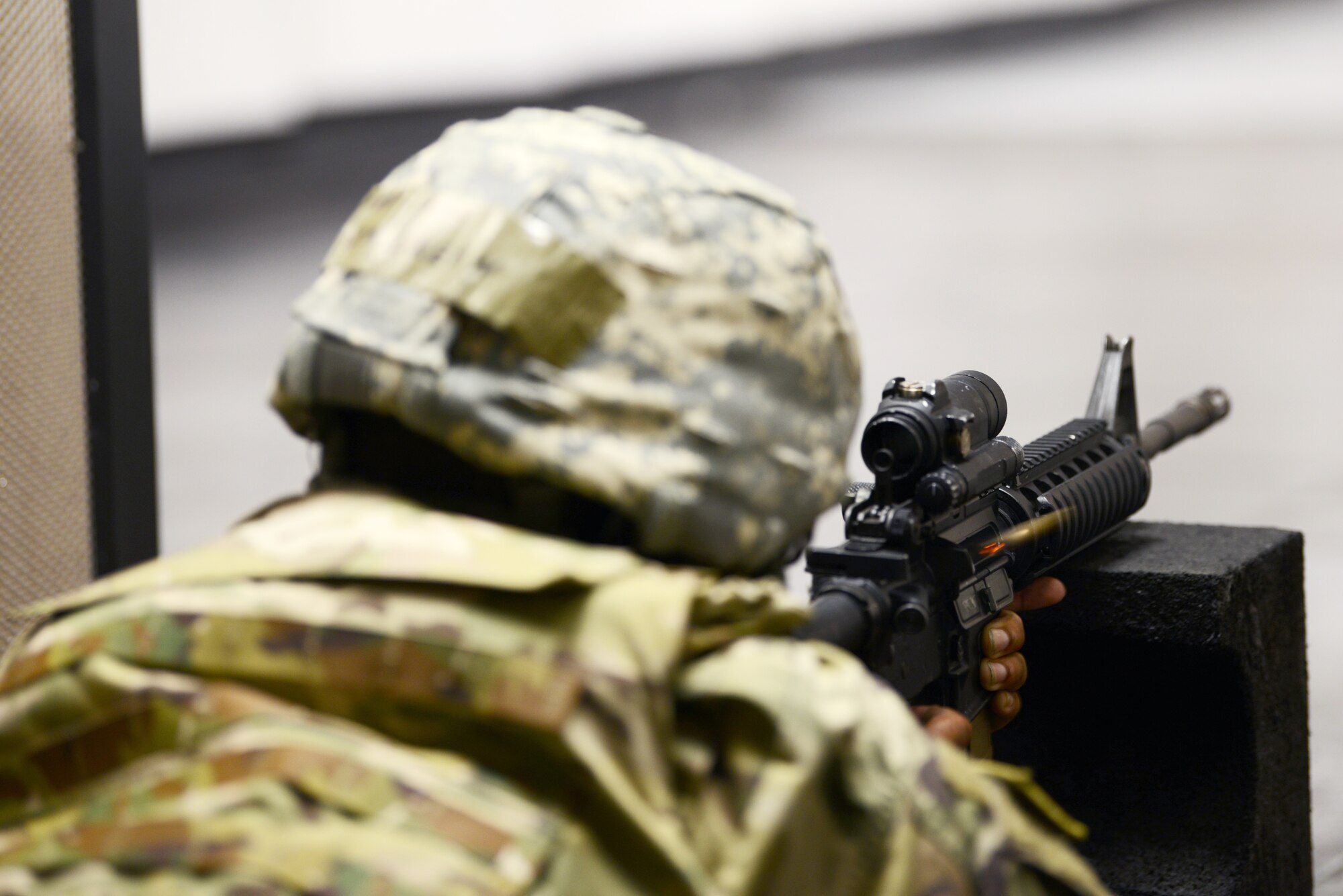 A student from the Air Force Qualification Course trains at Aviano’s indoor firing range at Aviano Air Base, Italy, June 20, 2019. The student fired at the prone-supported position. (U.S. Air Force photo by Airman 1st Class Ericka A. Woolever).