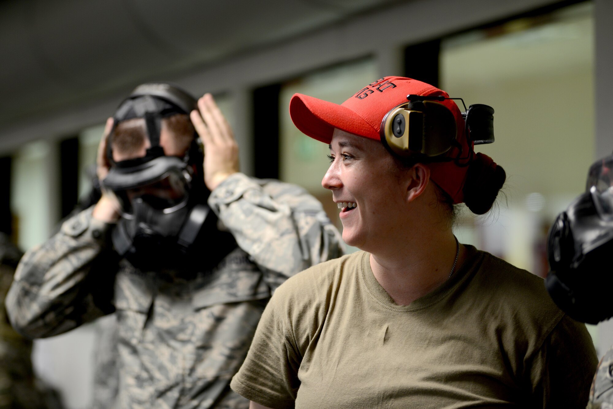 Staff Sgt. Brandee Hahn, combat arms instructor from the 31st Security Forces Squadron, at Aviano Air Base, Italy, teaches an Air Force Qualification Course at Aviano’s indoor firing range, June 20, 2019. There were 12 members in the class. (U.S. Air Force photo by Airman 1st Class Ericka A. Woolever).