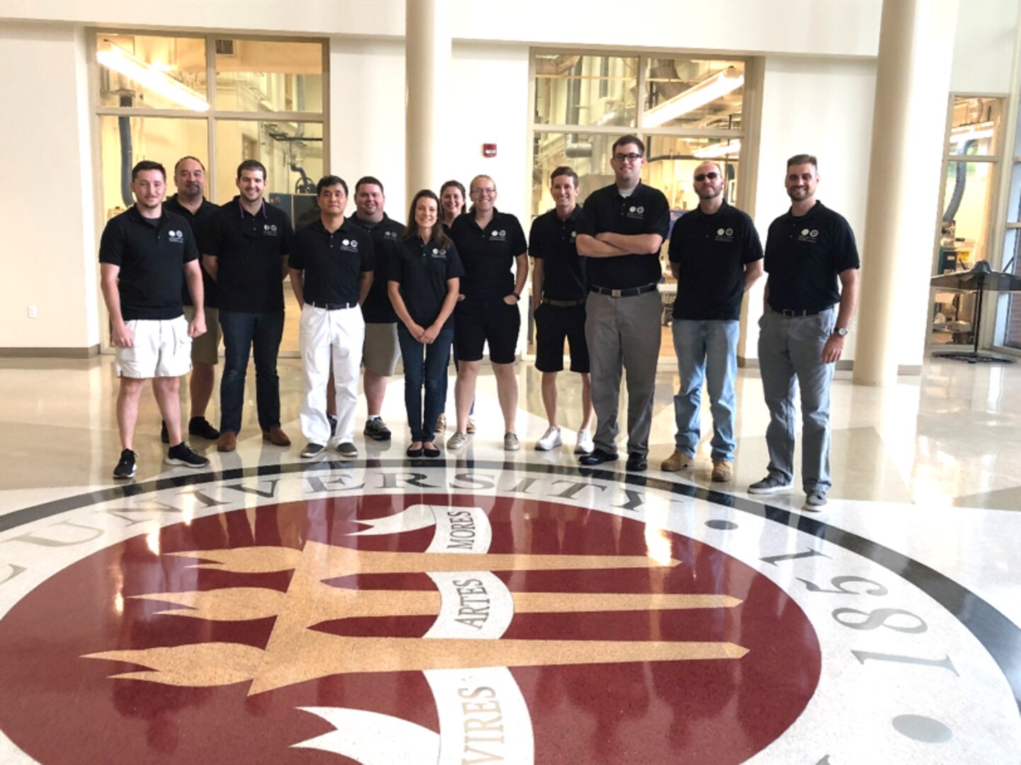 Naval Surface Warfare Center Panama City Division (NSWC PCD) employees enrolled in Florida State University Panama City’s (FSU PC) Master of Science in Systems Engineering program recently toured FSU’s Engineering Facilities in Tallahassee June 7. Touring the campus, the students posed for a group photo in the lobby at the university’s High-Performance Materials Institute. Pictured from left to right are: Payton Reid; Ron Miller; Dean Fevell; Dr. Changchun Zeng; Tommy McCroan; Tia Lilliman; Suzy Houser (NSWC PCD); Devin Ramsey (NSWC PCD); Alex Burgans (NSWC PCD); Dustin Freeburg (NSWC PCD); David Daigle (NSWC PCD); and Dr. Daniel Georgiadis.