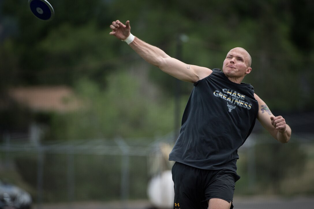 U.S. Marine Corps Gunnery Sgt. Dorian Gardner throws a discus during a 2018 DoD Warrior Games field practice at Cheyenne Mountain High School in Colorado Springs, Colo., May 25, 2018. The Warrior Games is an adaptive sports competition for wounded, ill and injured service members and veterans.