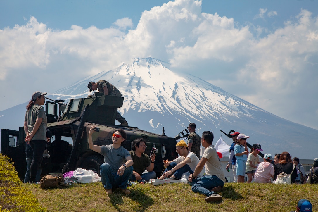 Festival attendees relax during the Friendship Festival May 11, 2019, on Combined Arms Training Center Camp Fuji, Shizuoka, Japan. The festival is one of the largest community relations events the Marine Corps hosts in Japan.