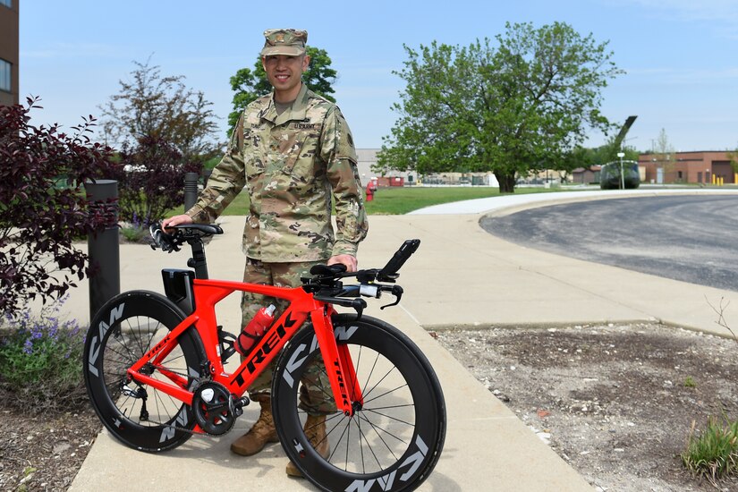 Maj. Christopher Tung pauses for a photo with his speed bicycle. Tung said the geometry and aerodynamics of the bike make it ‘really fast’.