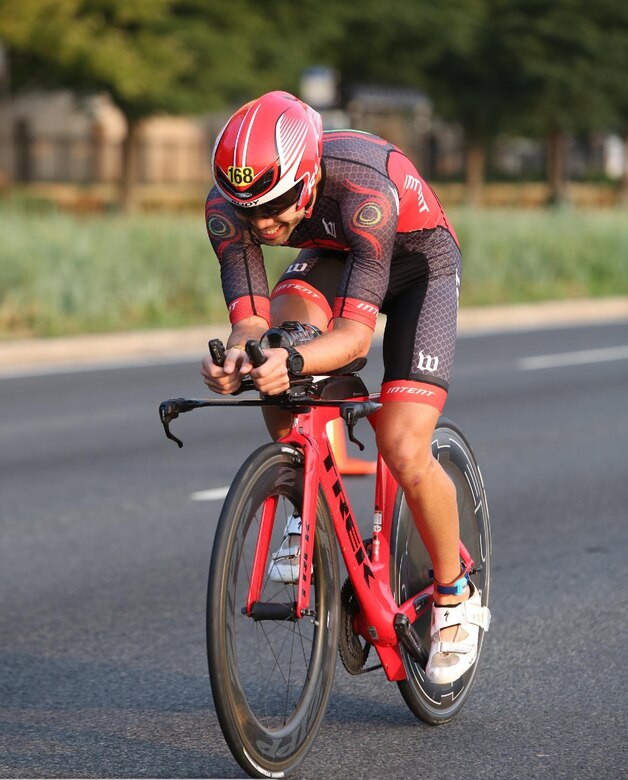 Maj. Christopher Tung rides his speed bicycle. Tung said the geometry and aerodynamics of the bike make it ‘really fast’.