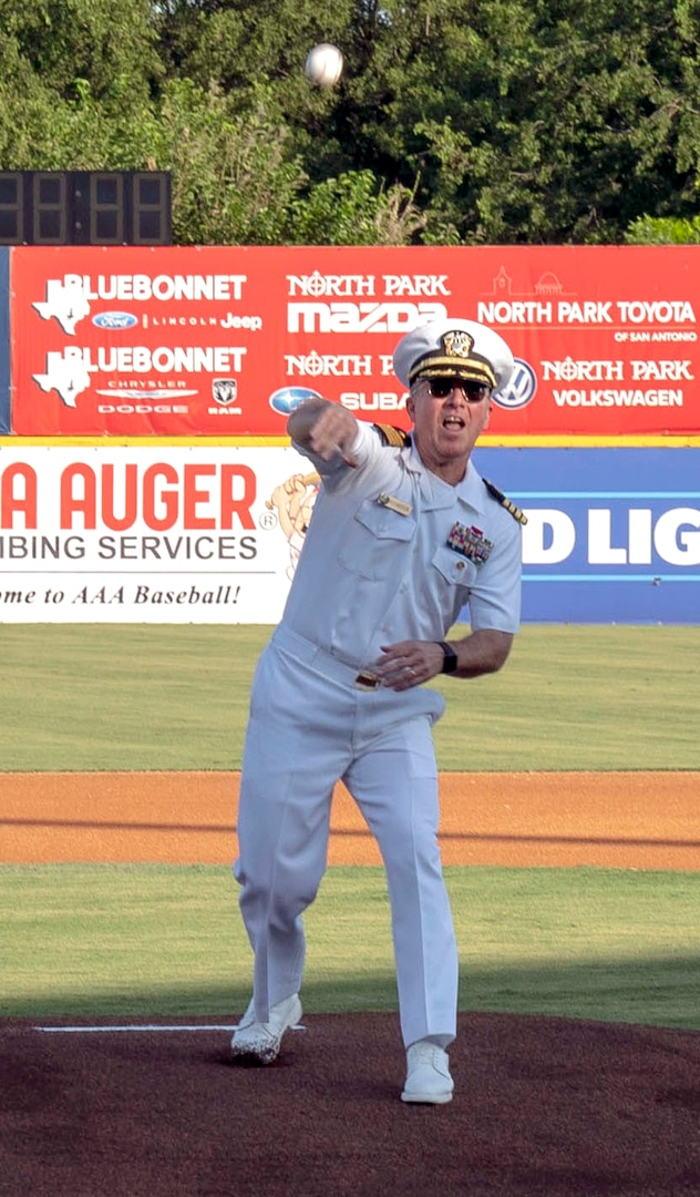 Capt. Tim Richardson, Navy Medicine Education, Training and Logistics Command deputy commander, throws out the traditional first pitch at a San Antonio Missions minor-league baseball game as part of Military Appreciation Night pre-game activities June 12.