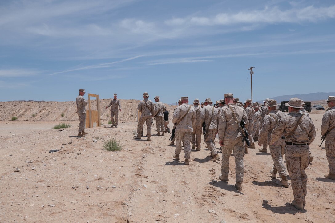 U.S. Marine Corps Chief Warrant Officer James Curtis, infantry weapons officer, 7th Marine Regiment, 1st Marine Division, I Marine Expeditionary Force, makes comments during the ribbon cutting ceremony for the re-opening of Range 105A at Marine Corps Air Ground Combat Center, Twentynine Palms, Calif., June 17, 2019. The range was re-designed to offer multiple, efficient types of training to individual Marines and squad-sized elements. (U.S. Marine Corps photo by Pfc. Gustavo Romero)