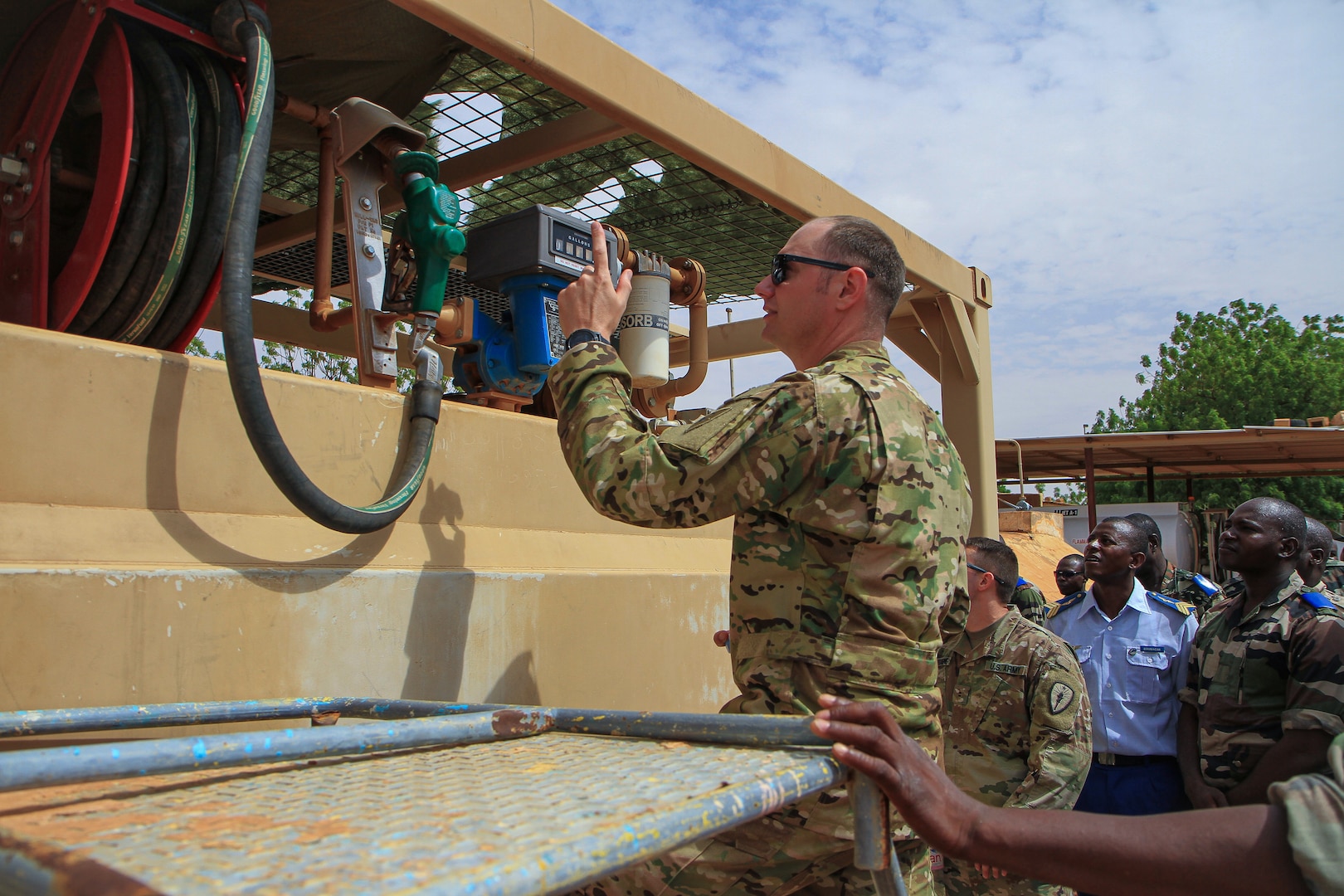 Chief Warrent Officer 2 Tracy Batten, a supervisory equipment specialist, gives a class over Excel and data analysis during the site visit component of Operation Hydrocarbon June 12, 2019 at Camp Badage, Niger. The operation was a five-day exercise with a goal of exchanging tactic, procedures, and techniques for fuel, logistical, and maintenance operations.