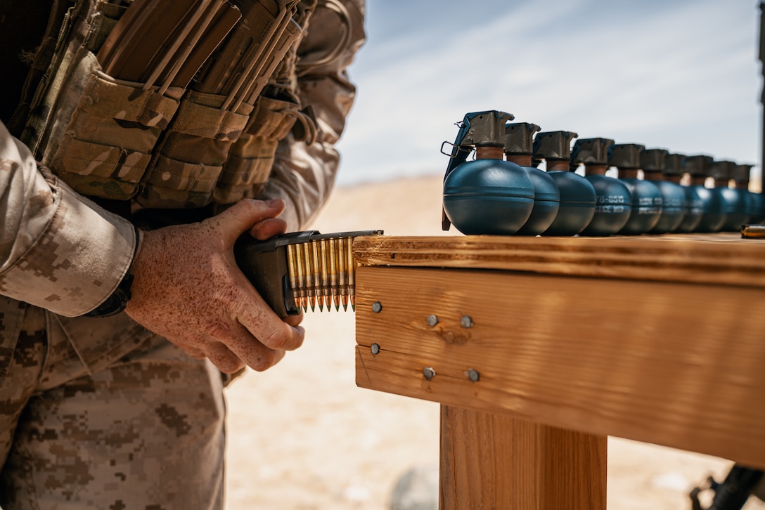 A U.S. Marine loads 5.56 mm ammunition into a magazine in preparation for a live-fire exercise following the re-opening of Range 105A at Marine Corps Air Ground Combat Center, Twentynine Palms, Calif., June 17, 2019. The range was re-designed to offer multiple, efficient types of training to individual Marines and squad-sized elements. (U.S. Marine Corps photo by Cpl. Rachel K. Young-Porter)
