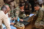 Chief Warrent Officer 2 Tracy Batten, a supervisory equipment specialist, gives a class over Excel and data analysis during the site visit component of Operation Hydrocarbon June 12, 2019 at Camp Badage, Niger. The operation was a five-day exercise with a goal of exchanging tactic, procedures, and techniques for fuel, logistical, and maintenance operations.