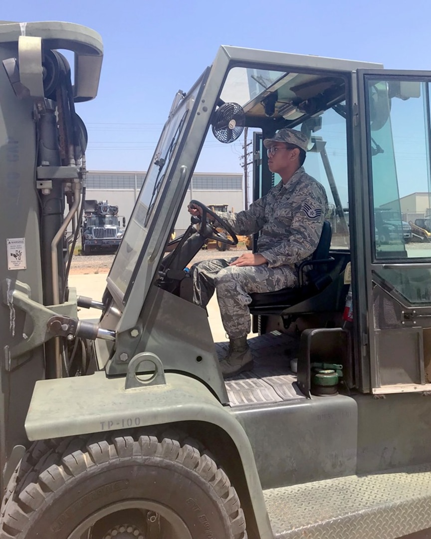 Staff Sgt. Ryker Deguzman, a member of the 149th Force Support Squadron, performs forklift operations during Home Station Readiness Training at March Air Reserve Base, California ‪June 17-2‬2. Heavy equipment vehicle operations is part of the annual readiness training that FSS members receive to better perform their primary mission during contingency operations.