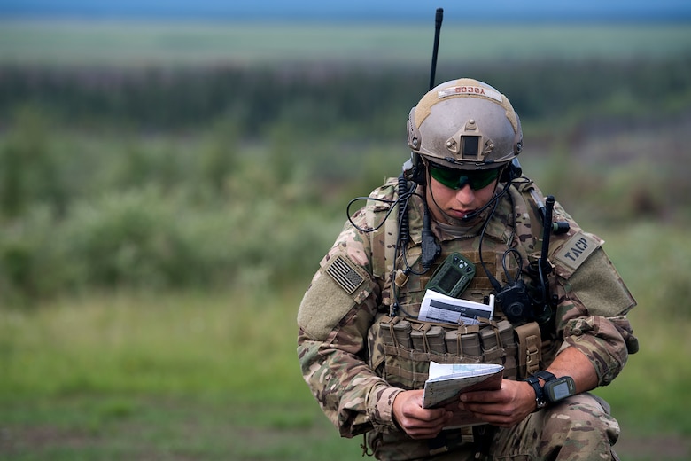 A Joint Terminal Attack Controller takes notes during close air support training