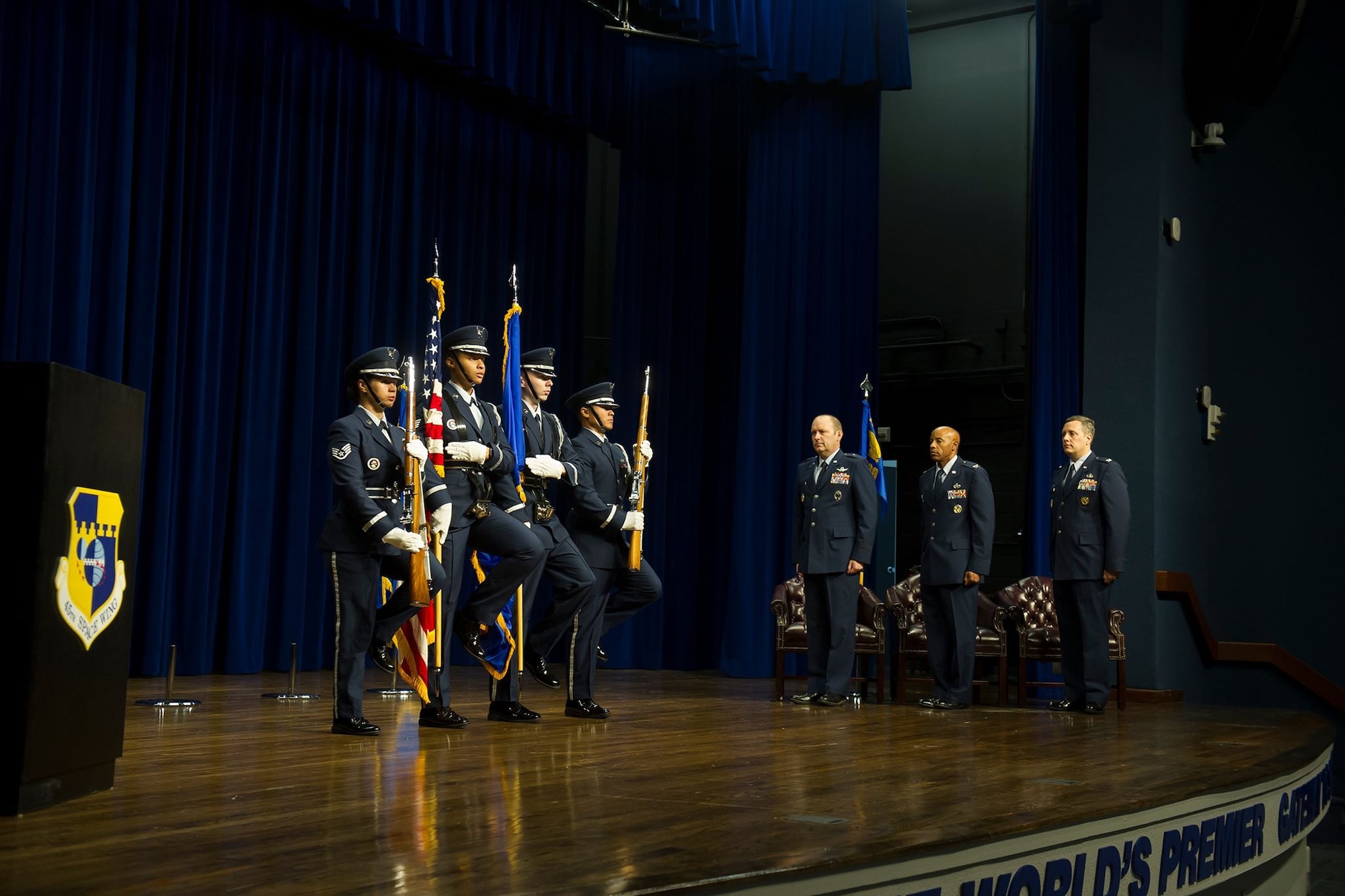 Brig. Gen. Douglas Shiess, 45th Space Wing commander, presents Col. Edward Marshall, incoming 45th Mission Support Group commander, with the 45th MSG guidon as he assumes command of the squadron. (U.S. Air Force photo by Jared Trimarchi)