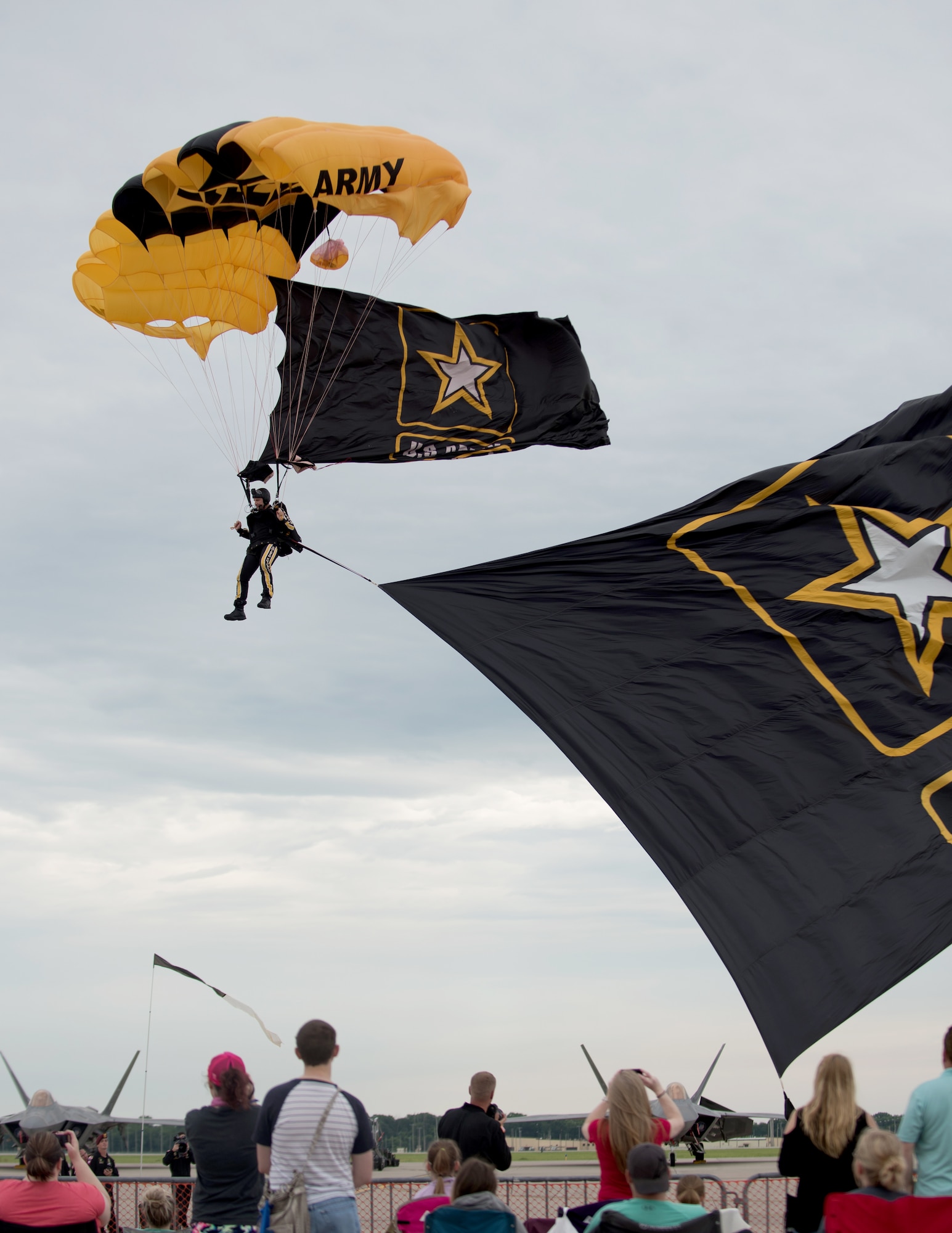 A paratrooper, assigned to the U.S. Army Golden Knights demonstration team, lands on the flight line at Whiteman Air Force Base, Missouri, on June 16, 2019. The Golden Knights performed throughout the 2019 Wings Over Whiteman Air and Space Show. (U.S. Air Force photo by Staff Sgt. Danielle Quilla)