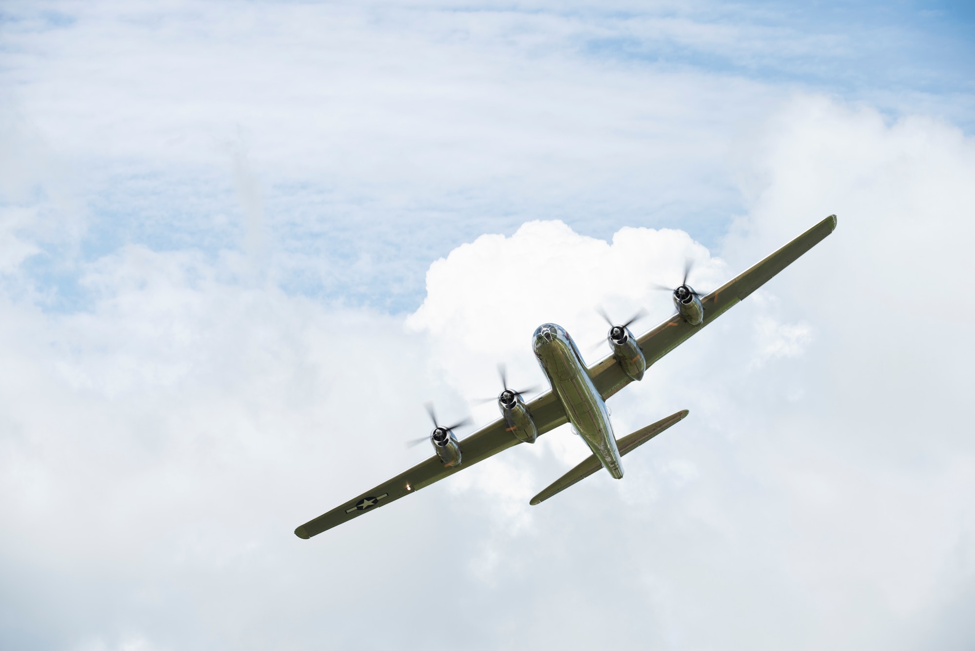 One of the two B-29 Superfortresses that still actively fly today soars over Whiteman Air Force Base, Missouri, on June 16, 2019. The B-29  is a four-engine propeller-driven heavy bomber designed by Boeing and flown primarily by the United States during World War II and the Korean War.(U.S. Air Force photo by Staff Sgt. Kayla White)
