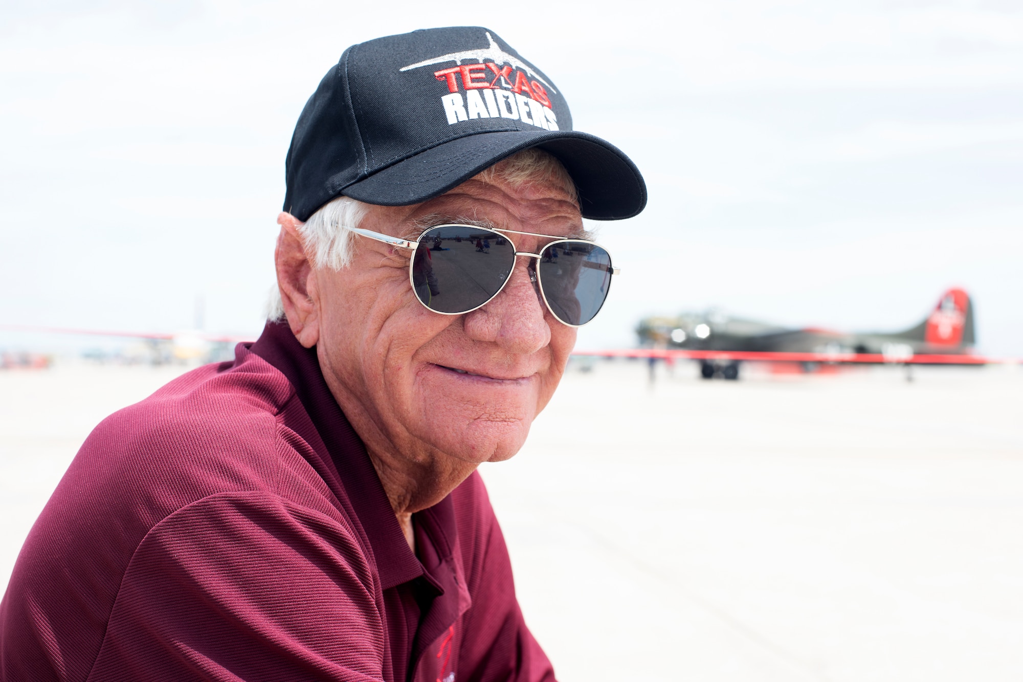 Dan Smith, a Golden, Missouri, native, poses for a portrait in front of a B-17 Flying Fortress on June 15, 2019, at Whiteman Air Force Base, Missouri. Smith and his wife have gone to more than 50 other air shows before attending the 2019 Wings Over Whiteman Air and Space Show. (U.S. Air Force photo by Staff Sgt. Kayla White)