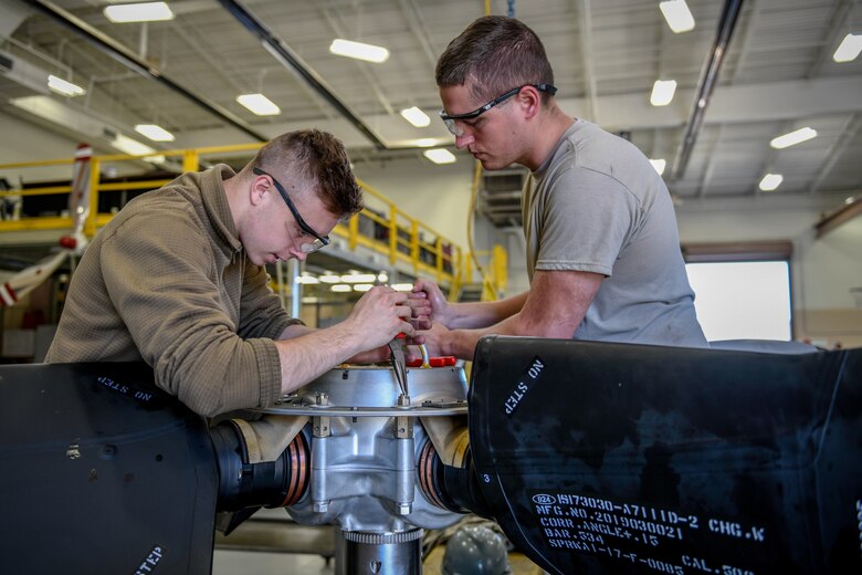 Senior Airman Sean Kenney, an aerospace propulsion apprentice with the 910th Aircraft Maintenance Squadron, and Senior Airman Daniel Phillis, an aerospace propulsion journeyman with the 910 AMXS, repair a propeller June 11, 2019, here.
