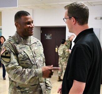 Maj. Gen. Patrick D. Sargent (left), commander U.S. Army Medical Department Center & School, Health Readiness Center of Excellence, engages with a group of more than 70 high school administrators, teachers and college professors visiting from across Wisconsin, Northern Illinois and Ohio sponsored by the Cleveland and Milwaukee U.S. Army Recruiting Battalions.