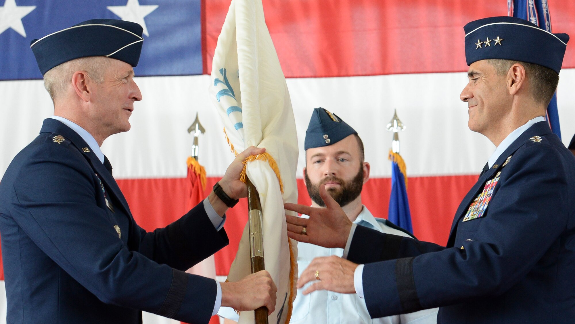 U.S. Air Force Lt. Gen. Marc Sasseville, commander, 1 AF (Air Forces Northern) and Continental U.S. North American Aerospace Defense Command Region (CONR) accepts the CONR (AFNORTH) guidon from General Terrance O’Shaughnessy, commander, United States Northern Command and North American Aerospace Defense Command, during a change of command ceremony June 20, 2019, Tyndall AFB, Fla.  O’Shaughnessy, along with General James Holmes, commander, Air Combat Command, officiated the 1 AF, CONR (AFNORTH) Change of Command.