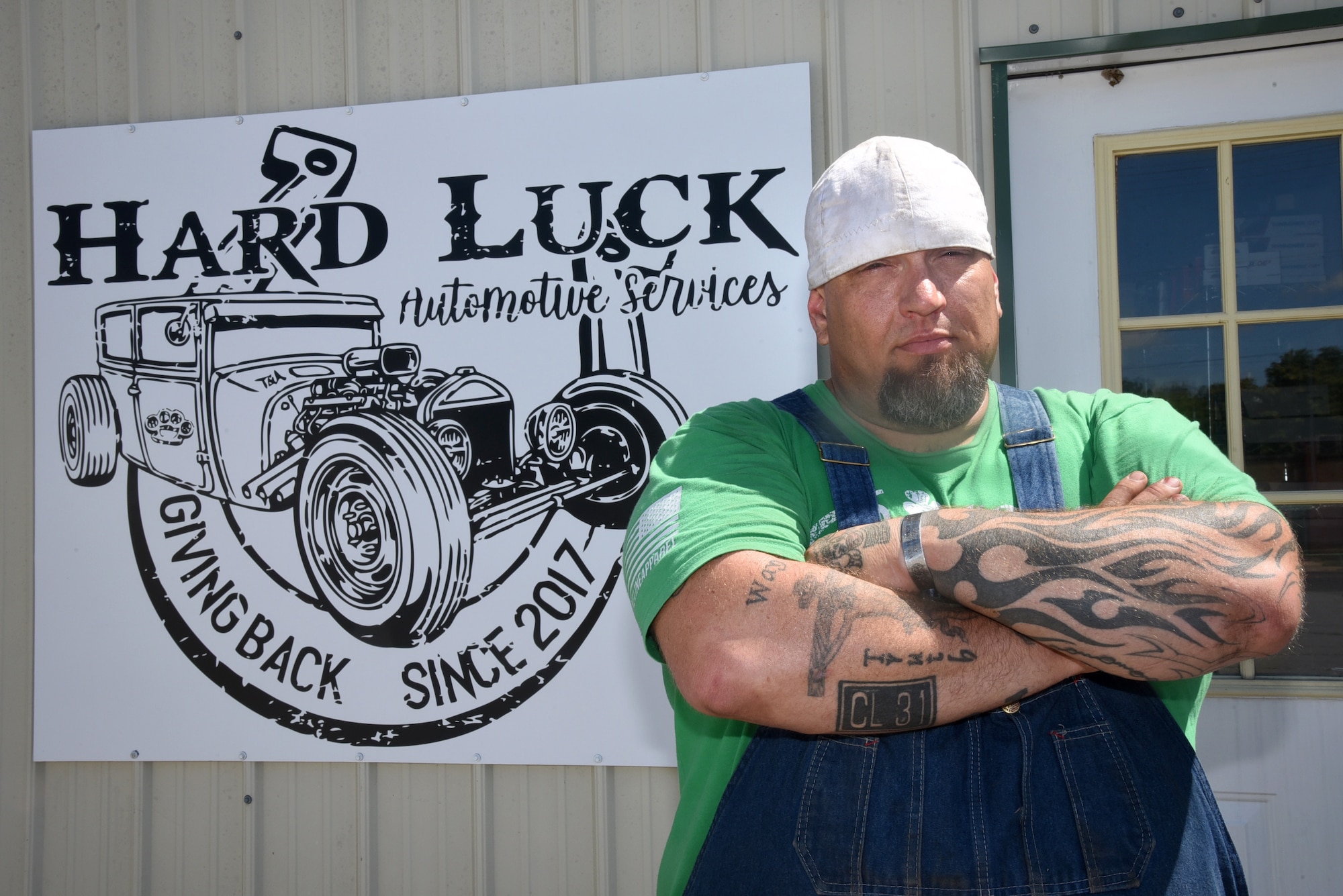 Army veteran, Adam Ely, owner and operator of Hard Luck Automotive Services, helps anyone, including Airmen and their families, who can't afford the high costs of vehicle repairs, at his shop in SW Oklahoma City. If an individual or a family can provide the necessary parts, Ely will fix the vehicle for free. Ely's spouse, Tony, is a Tinker employee, working B-52 software block upgrades. (U.S. Air Force photo/Kelly White)