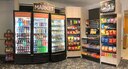 The first Micro Markets opened this week in Bldgs. 5929 and 5947. Micro Markets are mini-marts housed in the bottom of dormitories that are accessible 24/7. Consumers are able to make purchases with cash, card or credit through a key fob loyalty program. Partnering with the Army & Air Force Exchange Service and Imperial Vending, the Micro Markets are in place to compensate for the Dining Facility’s renovation closure. 72nd Air Base Wing Command Chief Master Sergeant Melissa Erb cuts the ribbon on the grand opening of the Bldg. 5929 Micro Market June 18 with Tinker Exchange Services Manager Angela Gray, Imperial Vending Distributor Jeremy Willhite and Exchange General Manager Vanessa Roland.