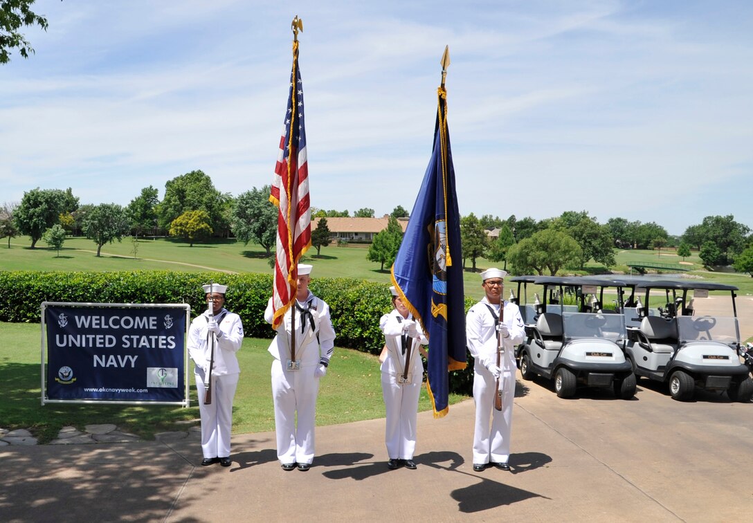 A color Guard from Strategic Ommunications Wing ONE parades the color prior to start of the 6th annual Gardner Tanenbaum Holdings OKC Navy Golf Classic at The Greens Country Club June 10, 2019. OKC Navy Days recognizes the Navy’s presence, investment, and contribution within the community. OKC Navy Days was founded in 2005. (U.S. Navy photo by Mass Communication Specialist 1st Class Leslie Long.)