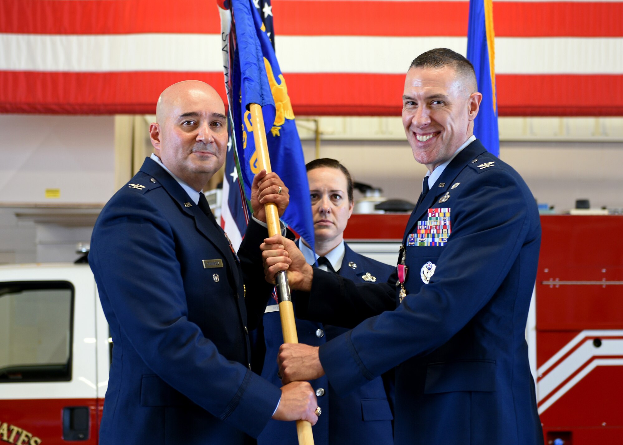 U.S. Air Force Col. Robert Ramirez, 17th Training Wing vice commander, accepts the guidon from Col. Jason Beck, 17th Mission Support Group outgoing commander, during the change of command ceremony at the Transportation Complex on Goodfellow Air Force Base, Texas, June 20, 2019. The 17th MSG sustains the Air Force’s largest sensitive compartmented information facility complex, the Louis F. Garland Joint Fire Protection Training Academy, over 3,000 dormitory rooms, and a food service program generating over a million meals per year. (U.S. Air Force photo by Airman 1st Class Robyn Hunsinger/Released)