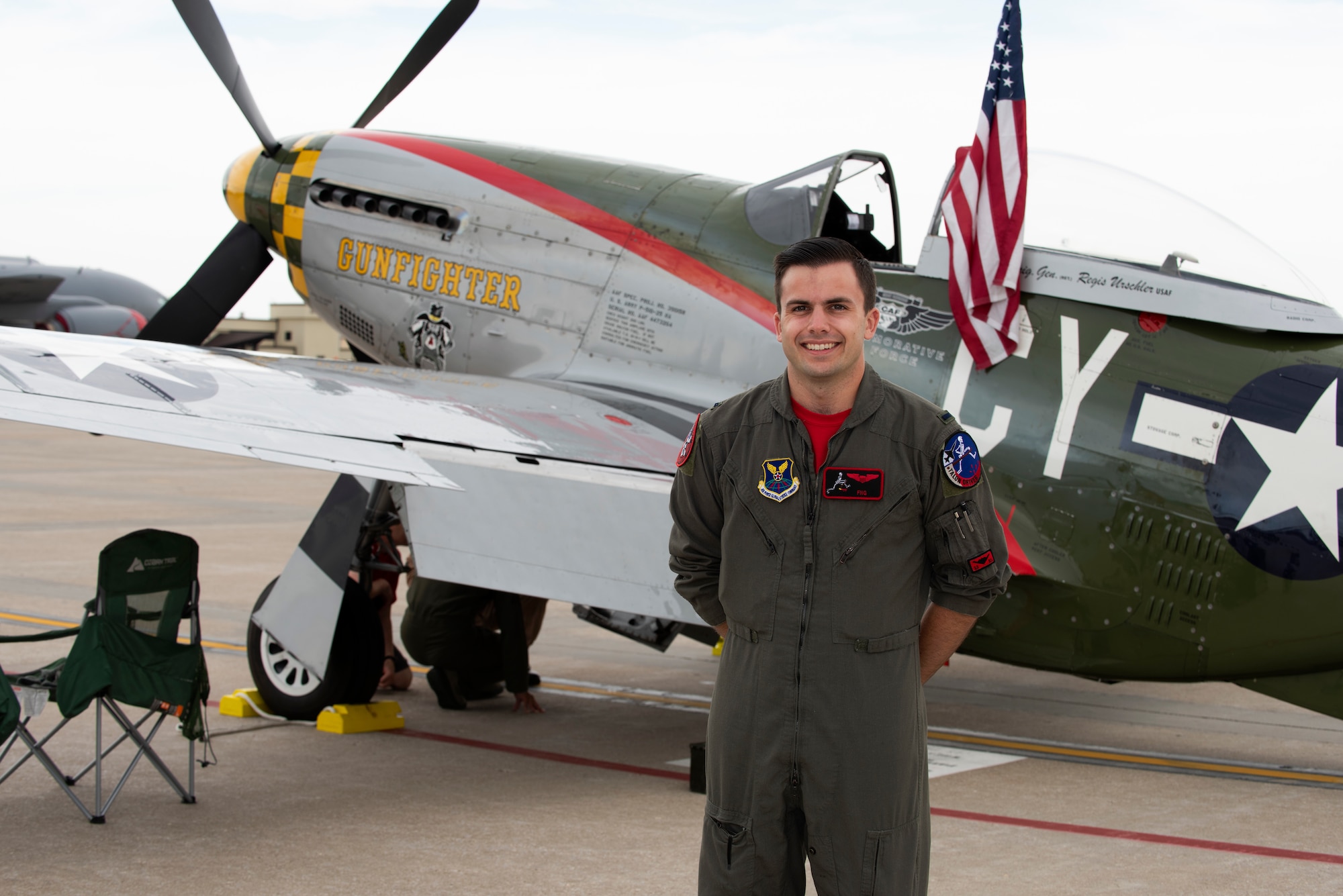 1st Lt. Jordan Tencati, a T-38 instructor pilot assigned to the 13th Bomb Squadron, poses for a portrait on June 16, 2019, at Whiteman Air Force Base, Missouri. Tencati visited the various historic aircraft, including the P-51 Mustang,on display at the 2019 Wings Over Whiteman Air and Space Show. (U.S. Air Force photo by Staff Sgt. Kayla White)