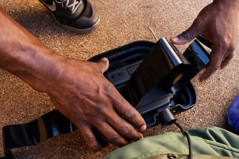 Airmen dawn protective gear to complete decontamination training