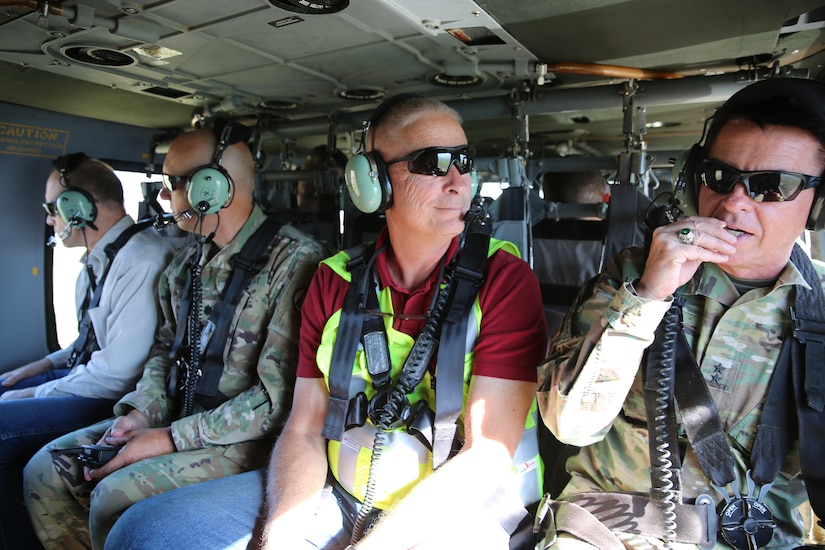 Major General Jeff Burton, the adjutant general; Allan Matheson, executive director of the Department of Environmental Quality; Joshua Emfield, deputy director for Congressman Curtis; Larry Ellertson, advisor to Congressman Curtis; Don Summit, engineer with Construction Facilities Management Office and other members of the Utah National Guard flew on a UH-60 Black Hawk to view the burn scar left from the Coal Hollow Fire on Loafer Mountain located at the south end of Utah County, June 19, 2019.