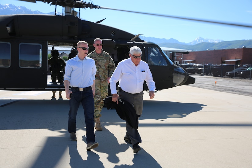 Larry Ellertson, advisor to Congressman Curtis; Joshua Emfield, deputy director for Congressman Curtis; Brig. Gen. Dar Craig, Director of Joint Staff, Utah National Guard exit the UH-60 Black Hawk after viewing the burn scar left from the Coal Hollow Fire on Loafer Mountain located at the south end of Utah County, June 19, 2019.