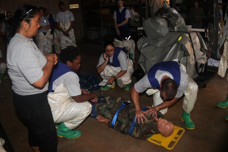 Airmen dawn protective gear to complete decontamination training