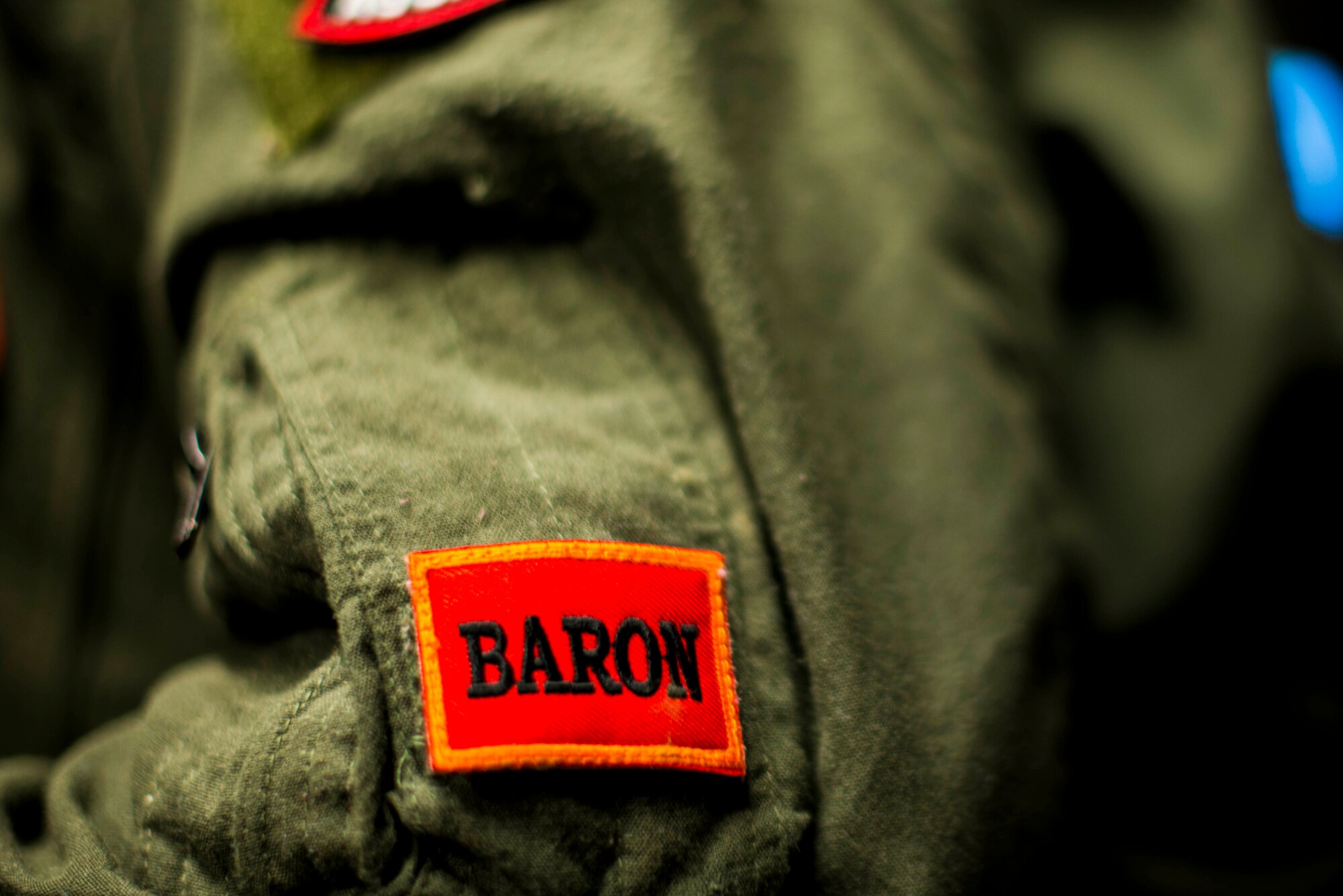 U.S. Air Force Capt. Solange Douglass, 18th Aggressor Squadron B flight commander, show off her Baron patch during RED FLAG-Alaska 19-2, at Eielson Air Force Base, Alaska on June 19, 2019. RF-A is a Pacific Air Forces-sponsored exercise designed to provide realistic training in a simulated combat environment with primary flight operations over the Joint Pacific Alaska Range Complex.(U.S. Air Force photo by Senior Airman Isaac Johnson)