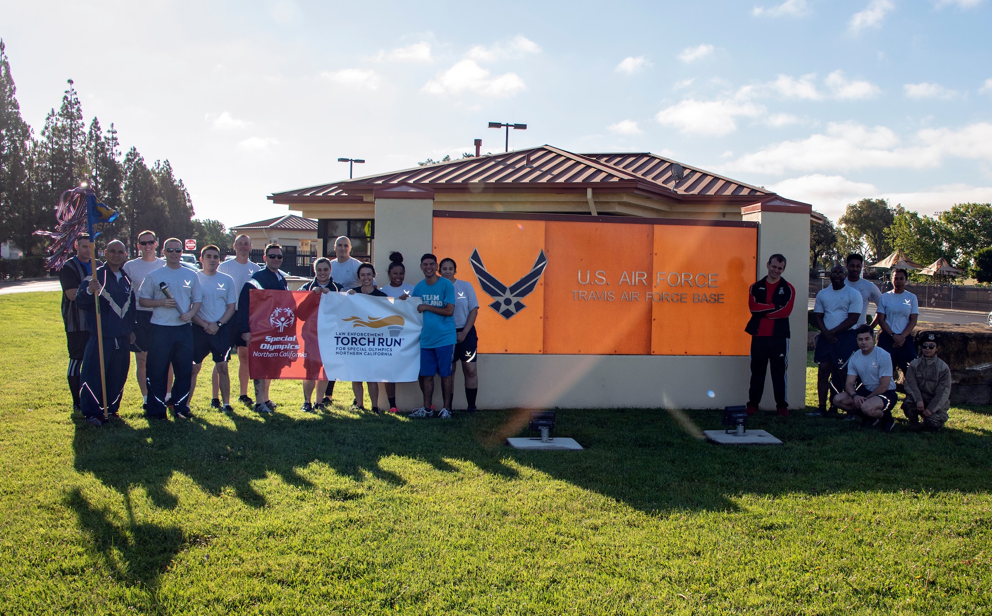 U.S. Air Force 60th Security Forces Squadron defenders and athletes from Solano County pose for a picture prior to participating in the Northern California Law Enforcement Torch Run June 20, 2019, at Travis Air Force Base, California. Hundreds of Law Enforcement personnel from northern California escorted the Special Olympics torch, the Flame of Hope, throughout their local communities in a relay to the 2019 Special Olympics Northern California Summer Games, being held at the University of California Davis campus June 21-23. (U.S. Air Force photo by Heide Couch)