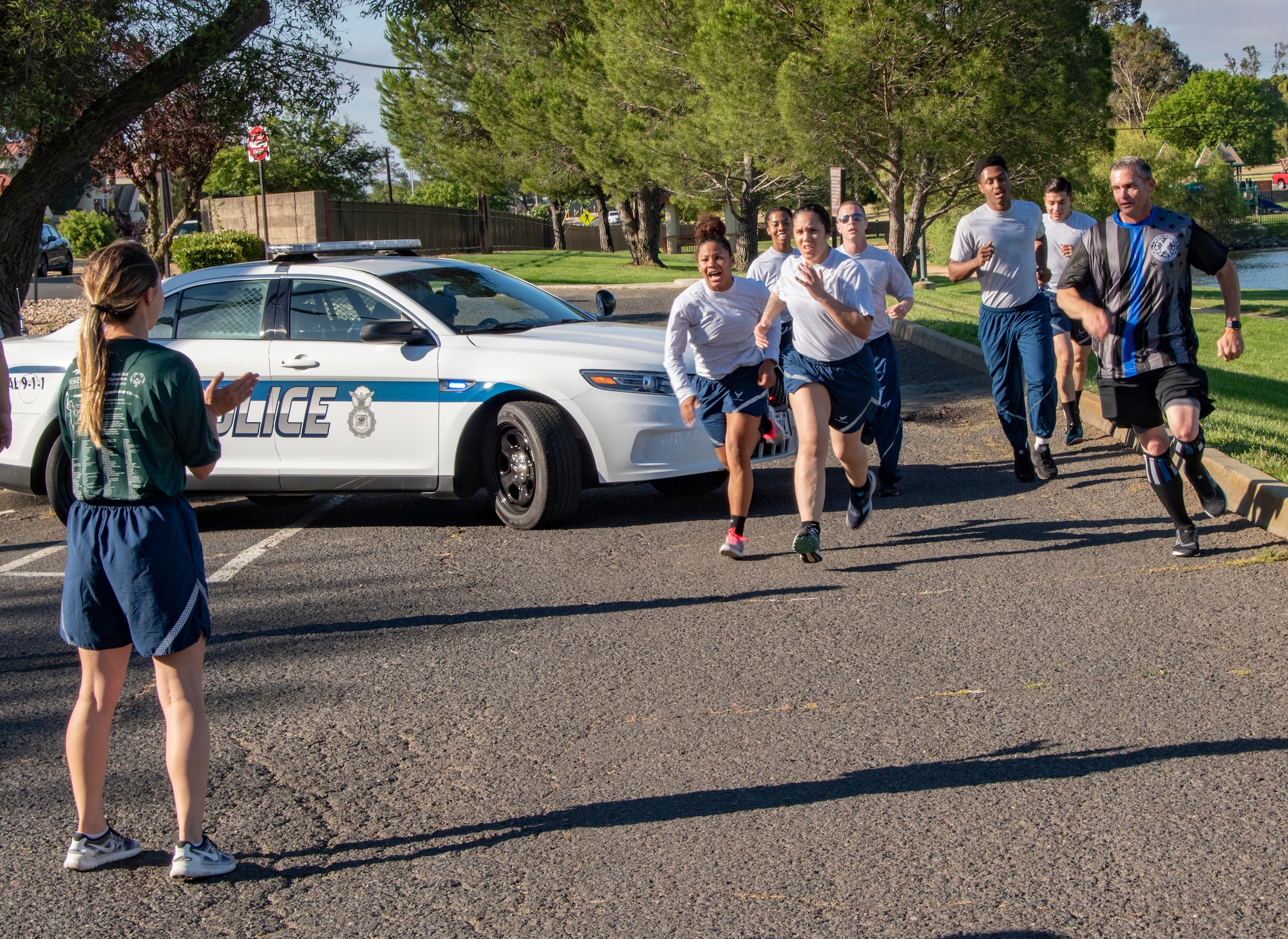 U.S. Air Force 60th Security Forces Squadron defenders complete their portion of the Northern California Law Enforcement Torch Run June 20, 2019, at Travis Air Force Base, California. Hundreds of Law Enforcement personnel from northern California escorted the Special Olympics torch, the Flame of Hope, throughout their local communities in a relay to the 2019 Special Olympics Northern California Summer Games, being held at the University of California Davis campus June 21-23. (U.S. Air Force photo by Heide Couch)