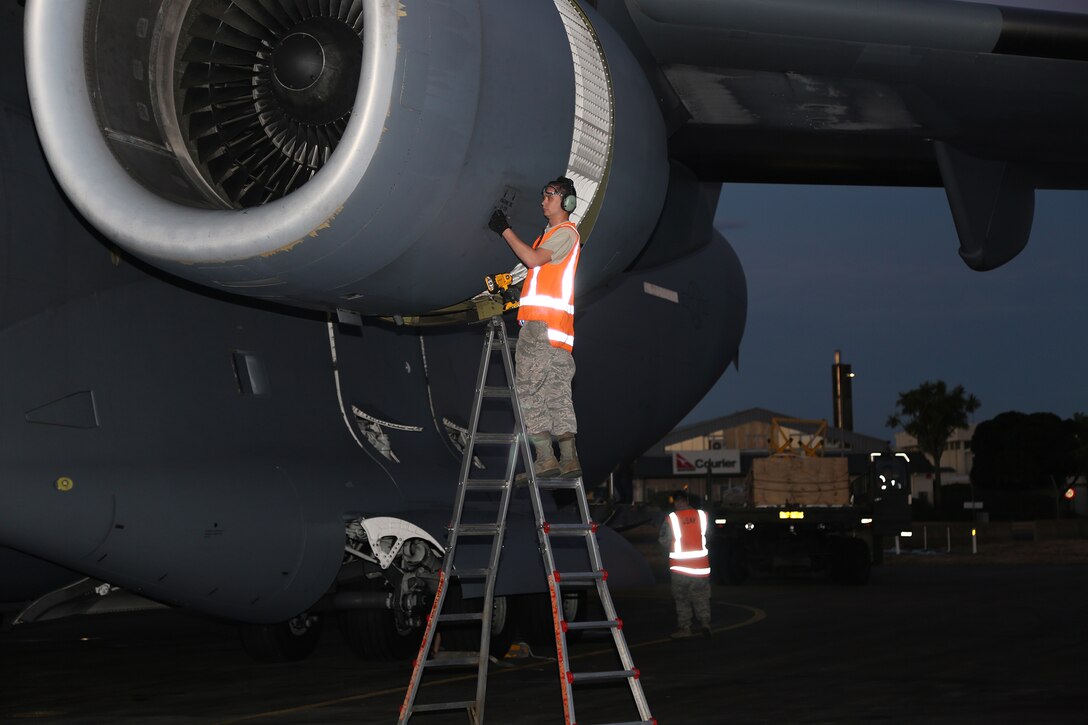 Maintainers assigned to the 304th Expeditionary Airlift Squadron work to ready the U.S. Air Force C-17 Globemaster III for the next Operation Deep Freeze flight Christchurch International Airport, Christchurch, New Zealand, Feb. 21, 2019. The 304th EAS is manned with deployed members from both the active duty 62nd Airlift Wing and reservists from the 446th Airlift Wing.
