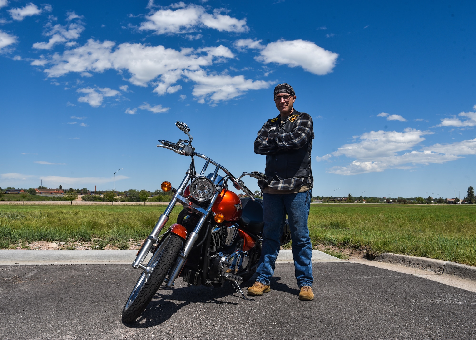 Chief Master Sgt. Beau Jones, 90th Missile Maintenance Squadron maintenance advisor, stands with his motorcycle June 20, 2019, on F.E. Warren Air Force Base, Wyo. Jones purchased his motorcycle after he was promoted to Master Sergeant and was looking for a new hobby (U.S. Air Force photo by Senior Airman Braydon Williams)