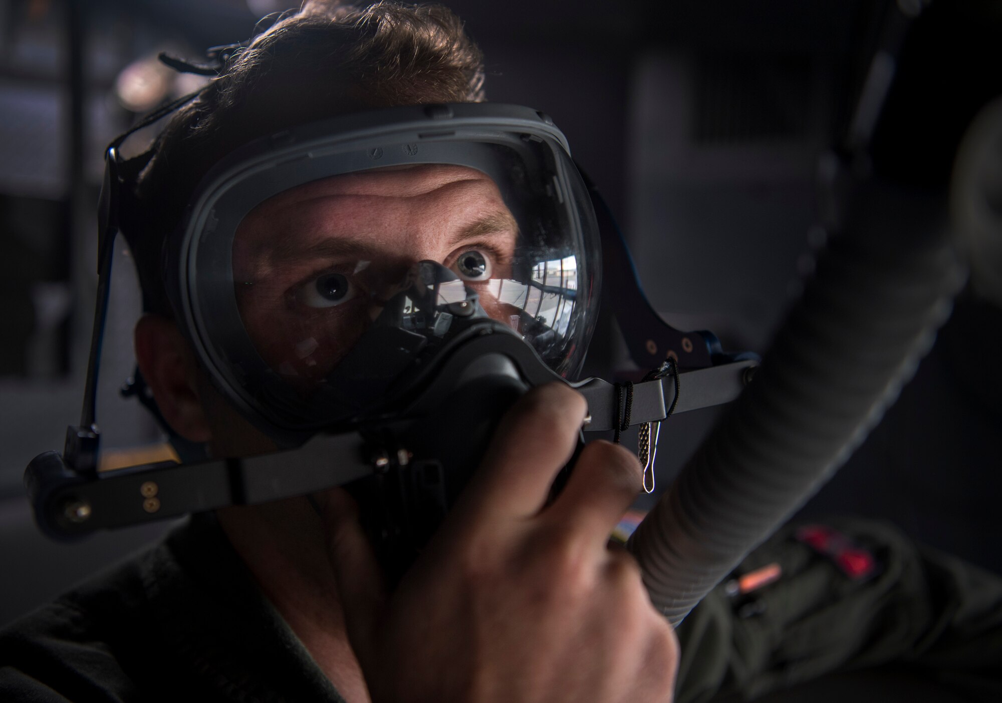 U.S Air Force Senior Airman Jonathan Cummins, 700th Airlift Squadron flight engineer, checks his oxygen levels on a C-130 Hercules before RED-FLAG-Alaska 19-2 near Joint Base Elmendorf-Richardson, Alaska, June 19, 2019. RED-FLAG-Alaska is an annual U.S. Pacific Air Forces field training exercise for U.S. and allied partners to practice combat readiness in a controlled environment. (U.S. Air Force photo by Staff Sgt. Matthew Lotz)