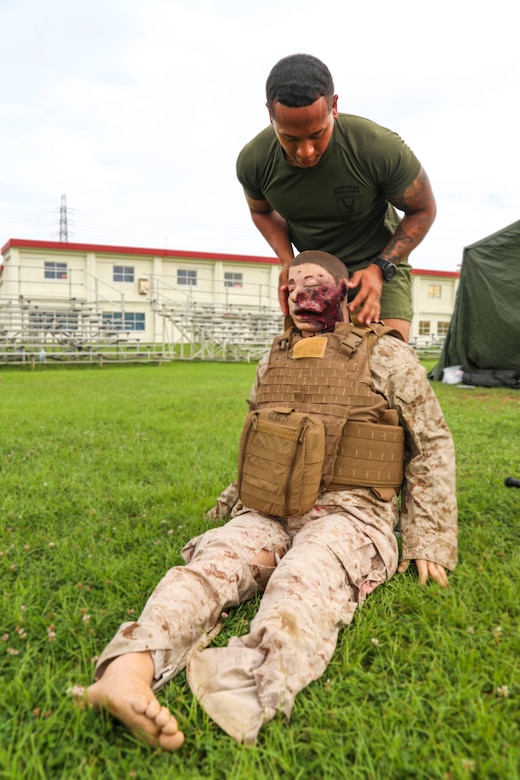 U.S. Navy Chief Hospital Corpsman Anaalicia Henderson, assigned to 3rd Medical Battalion, 3rd Marine Logistics Group (3rd MLG), provides care to a simulated casualty June 17, 2019 on Camp Foster, Okinawa, Japan.